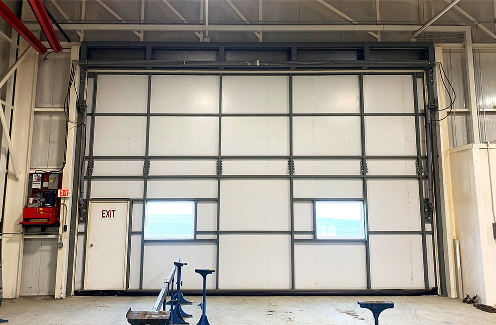Arkansas Door by Schweiss with a Single Top Truss Freestanding Self Supporting Header Framework