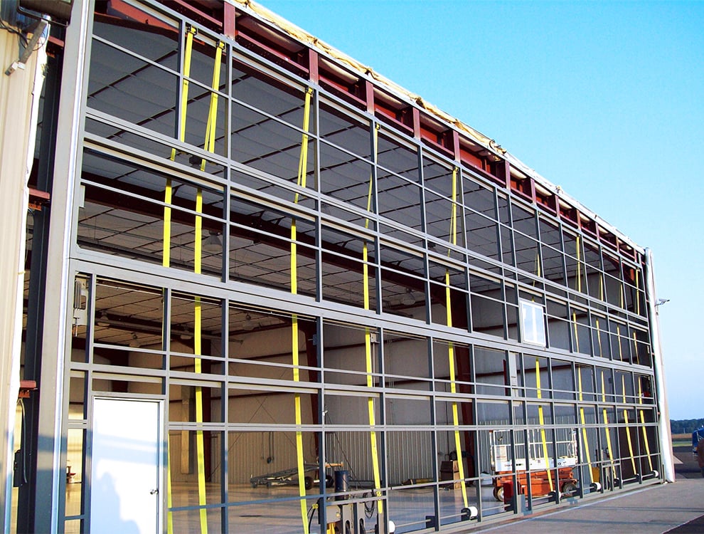 Install Schweiss Door on big hangar.