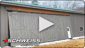 Schweiss One-Piece Door clad in custom wood siding.