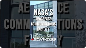 A NASA Aerospace Communications Facility utilizes a glass strap bifold door from Schweiss!