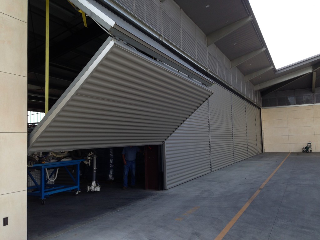Six Schweiss Lift Strap Bifold Door On Opus One Maintenance Building
