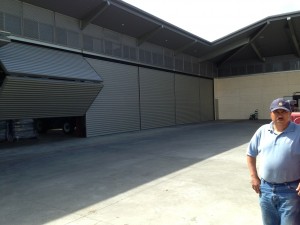 Juan standing outside in the courtyard with schweiss bifold door opening up