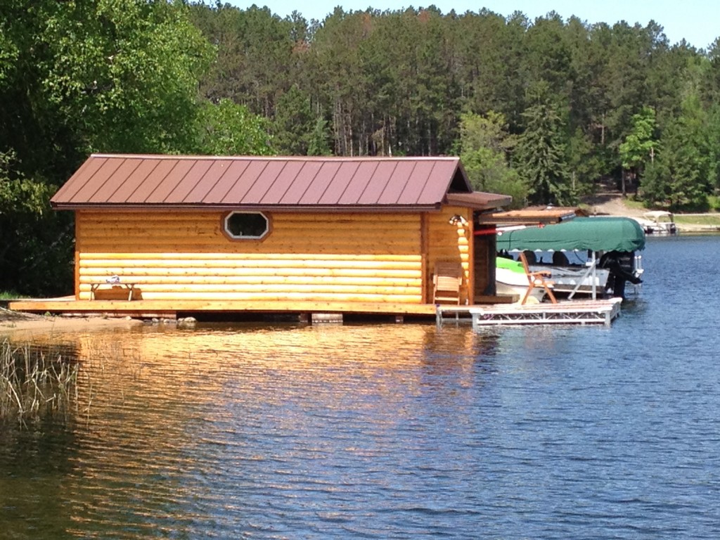 Hydraulic or bifold remote opening boathouse doors make docking your watercraft easy in all types of weather