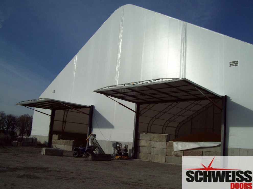 Two or more hydraulic doors on a round building