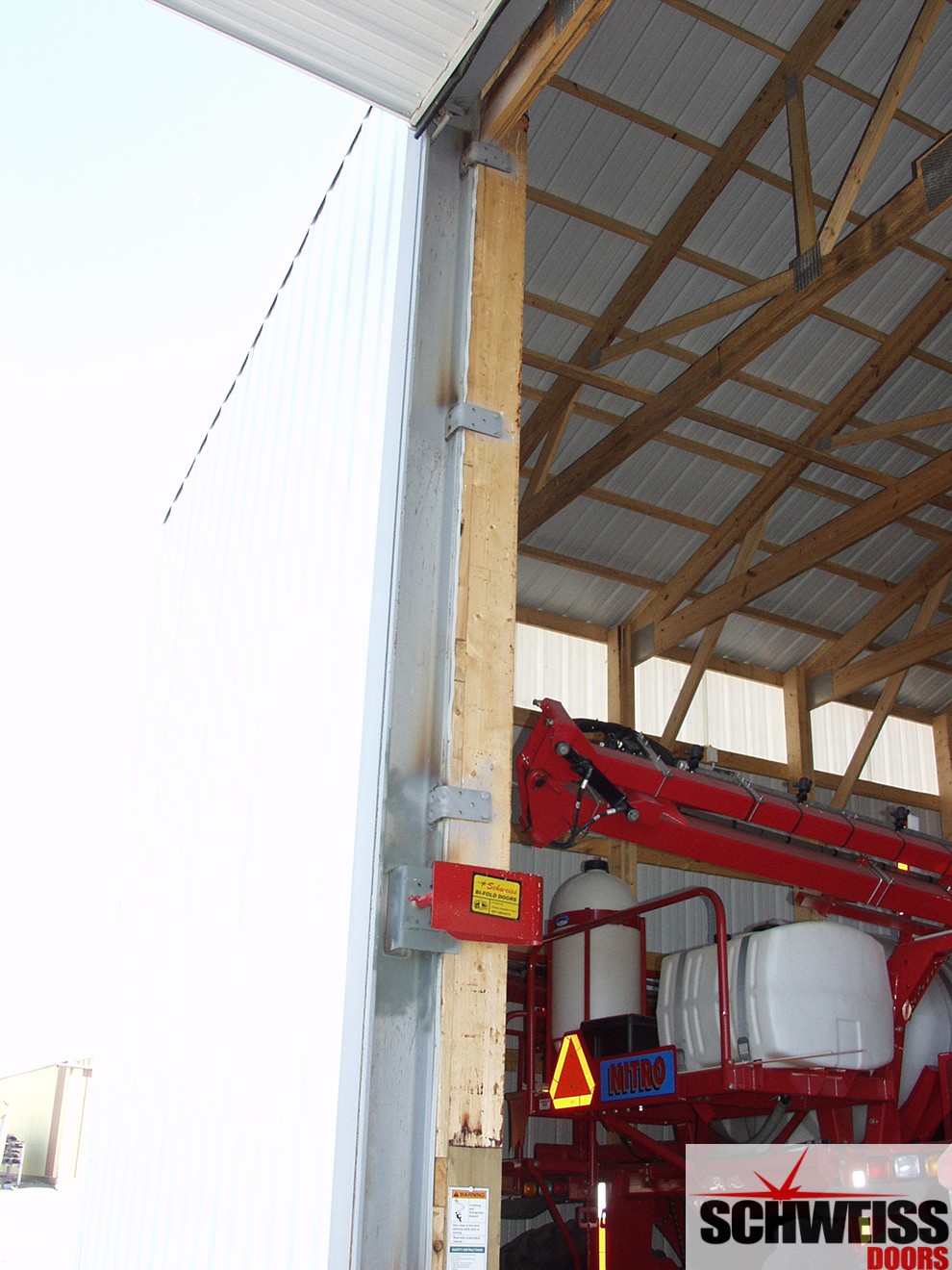 Hydraulic door sub-frame attaches to vertical jambs