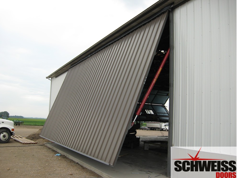 Hydraulic doors for farm, ranch and agricultural use have a clean look