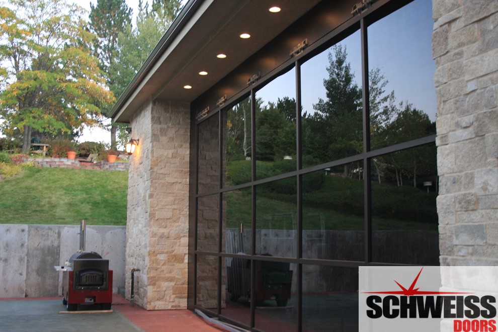 Hydraulic doors with glass for patios and garages