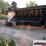 Hydraulic patio and garage doors with glass exterior