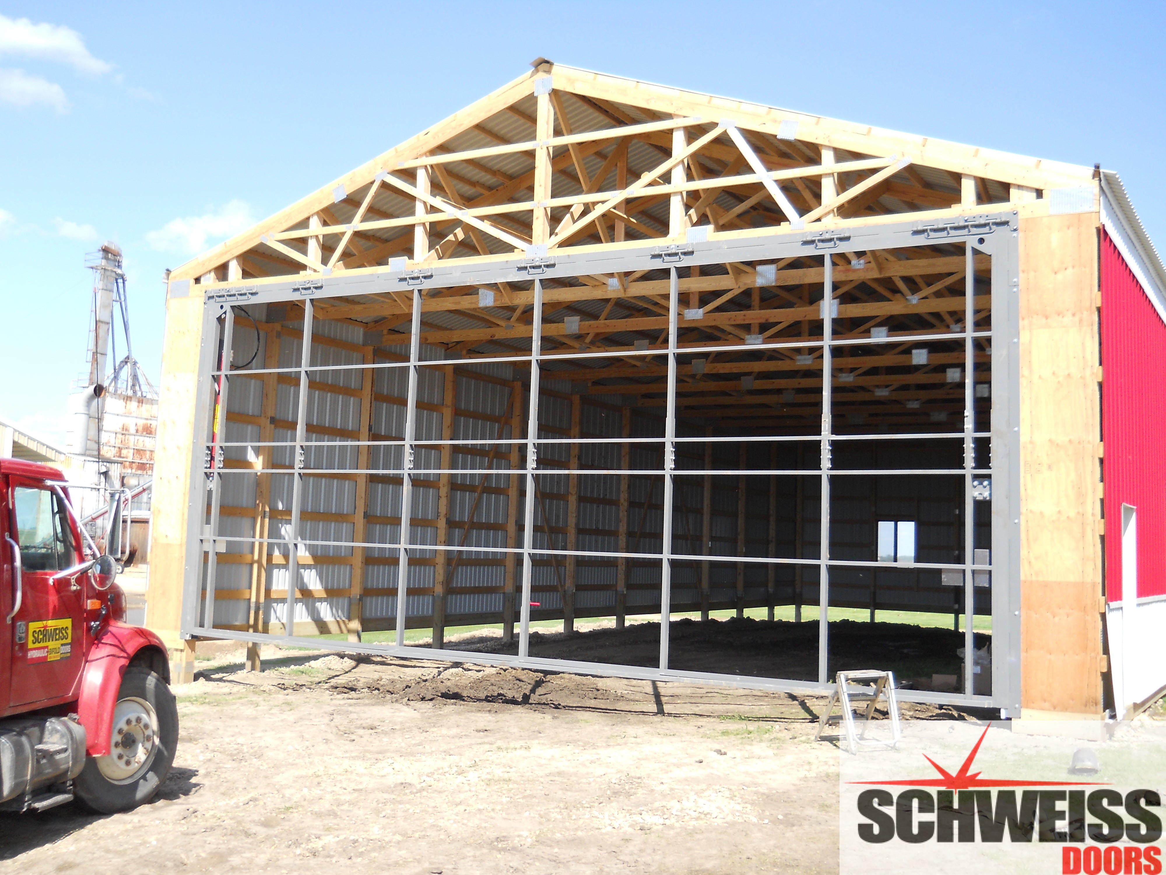 Schweiss Hydraulic doors on pole barns are easy to install